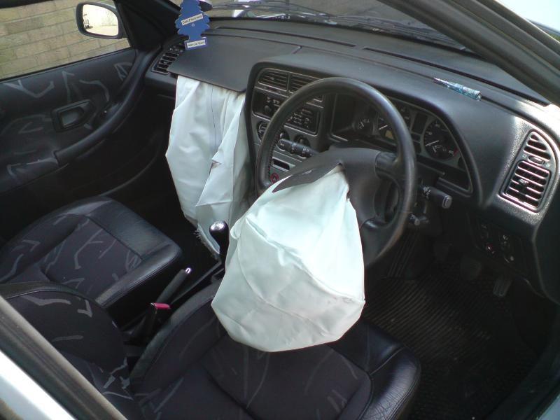Deployed airbags inside a car following an accident