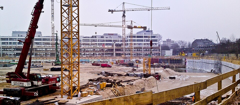 Cranes and scaffolding at a large construction site